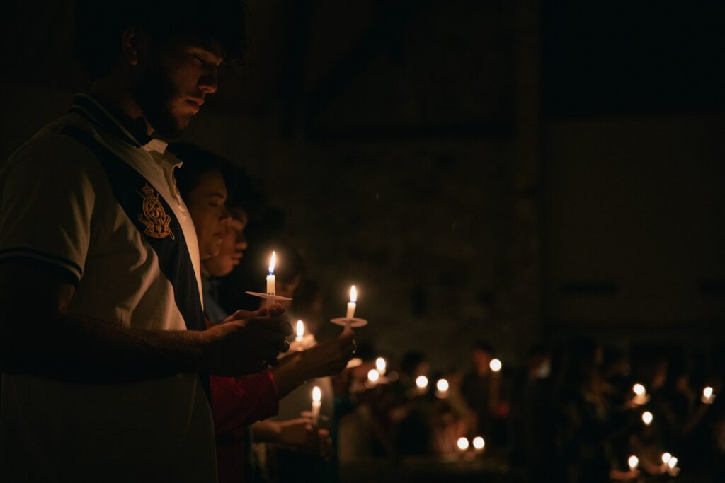 Photo by Zach Lucero - Best Travel and Cruise New Zealand a man and a woman holding candles in their hands